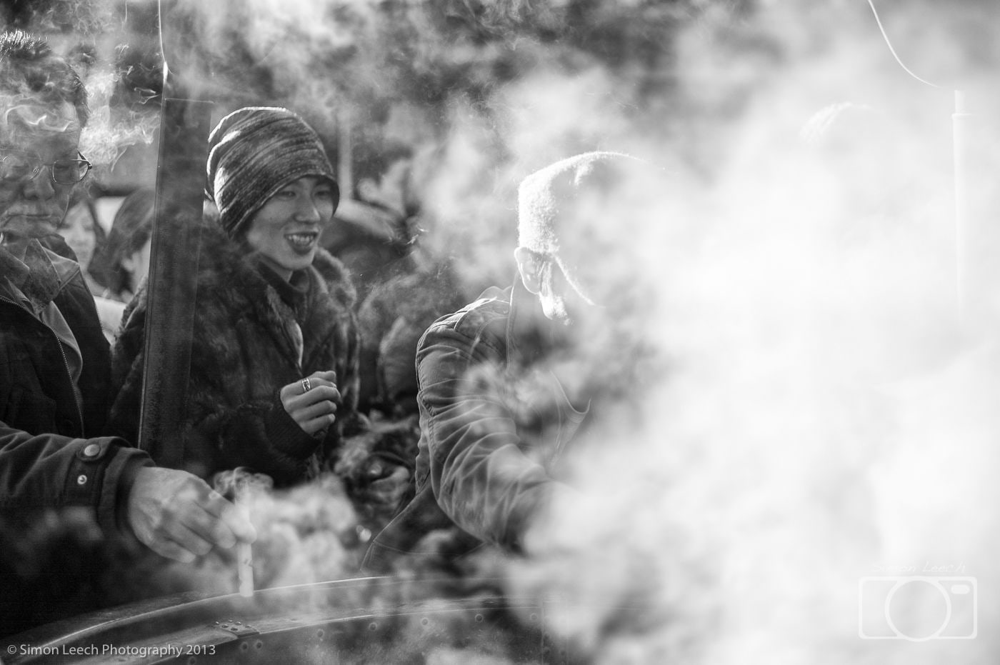 Lighting incense sticks in Asakusa